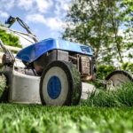Close-up of lawn mower cutting the grass